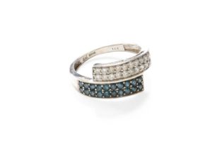 A 14 Carat White Gold Diamond and Fancy Teal Coloured Diamond Crossover Ring, the plain polished