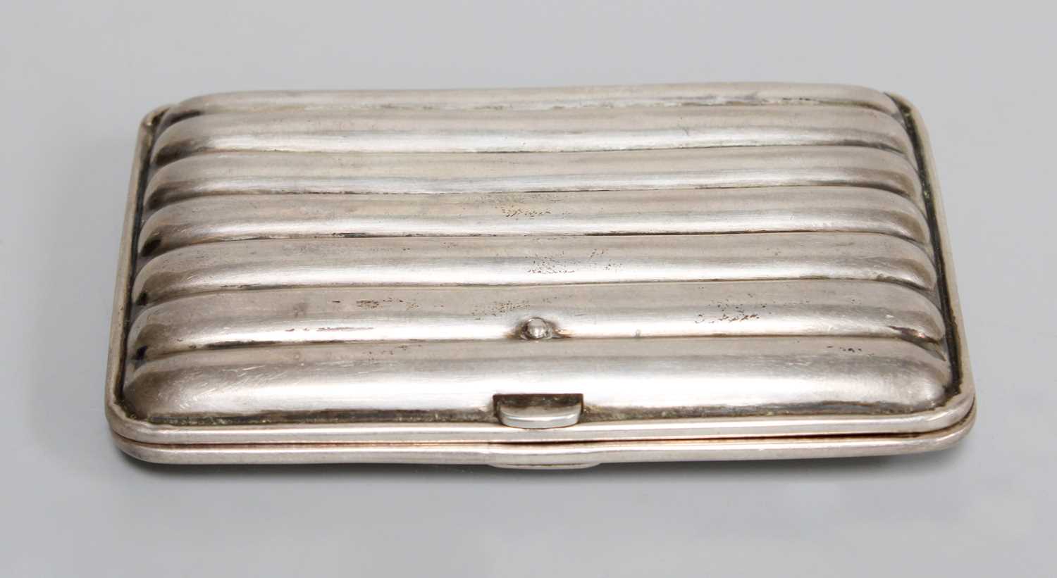 A Tin Trunk, containing copper, silver cigarette case, etc