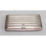 A Tin Trunk, containing copper, silver cigarette case, etc