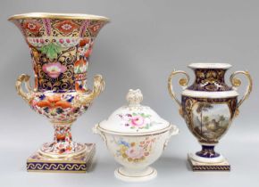 A Derby Porcelain Campana Urn, 19th century, painted in the Imari style with panels of flowers,