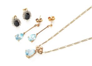 A 9 Carat Gold Blue Topaz and Diamond Pendant on A 9 Carat Gold Chain, pendant length 1.6cm, chain