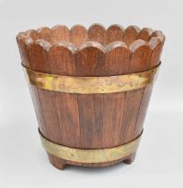 A Staved Oak Planter, brass bound and with scalloped rim, 29.5cm diameter by 28cm high