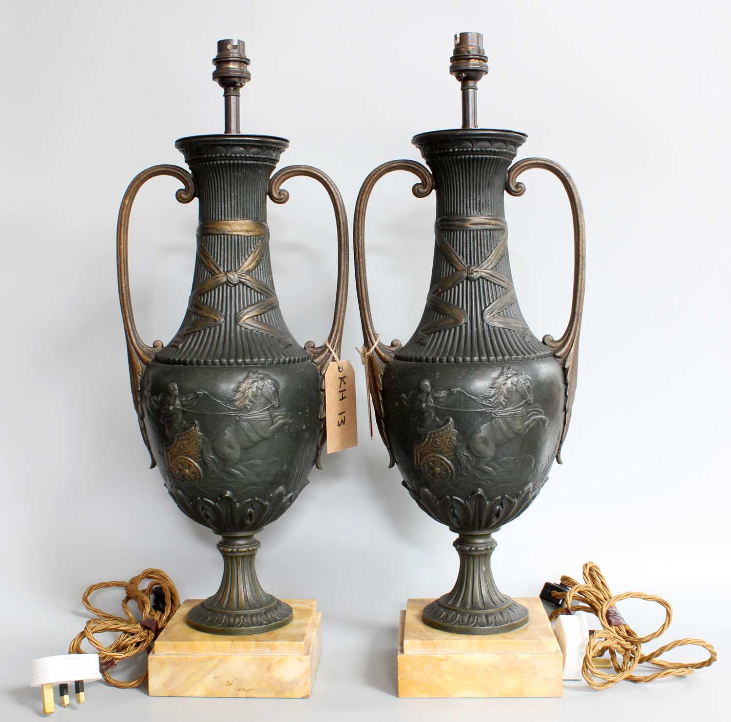 A Pair of Classical Style Patinated Metal Urn Form Table Lamps, on square section marble bases and