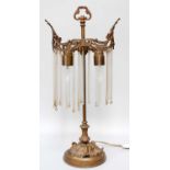 A Gilt Metal Table Lamp, with glass drops Height: 57cm the end ball finials to the glass rods,