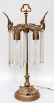 A Gilt Metal Table Lamp, with glass drops Height: 57cm the end ball finials to the glass rods,