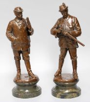 A Pair of Patinated Bronze Figures of Tyrolean Hunters, early 20th century, each modelled with a