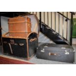 A Leather and Canvas Bound Dome Top Steamer Trunk, together with a wooden bound suitcase and a