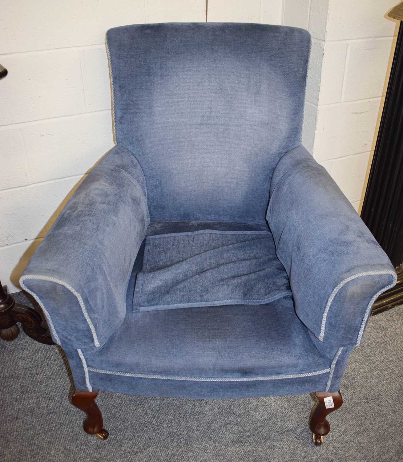 A Mahogany Framed Blue Upholstered Armchair, with cabriole legs moving on castors.