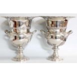 A Pair of Silver Plate Wine Coolers, baluster and on spreading foot, with fruiting grapevine stamped