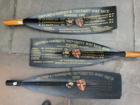 Three Oxford and Cambridge University Boat Race Oars, dated 1974, 1976 and 1983, each painted