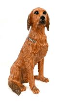 An Italian Faience Figure of a Red Setter, modern, naturalistically modelled and painted seated with
