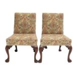 A Pair of George III Carved Mahogany Dining Chairs, late 18th century, recovered in modern floral