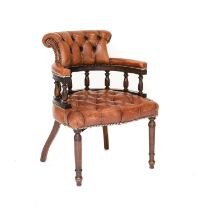 A Reproduction Buttoned and Close-Nailed Brown Leather Office Armchair, the stained mahogany frame