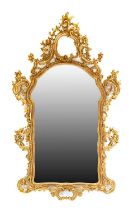 An Italian Giltwood Composition Mirror, modern, the bevelled glass plate within a moulded frame with