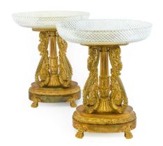 A Pair of Regency Gilt and Patinated Bronze Centrepieces, the oval hobnail cut glass bowls on a