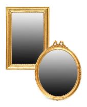 A Victorian-Style Oval Mirror, modern, the bevelled glass plate with moulded frame decorated with