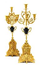 A Pair of Gilt Metal Five-Light Candelabra, in Louis XIV style, with leaf sheathed scroll branches