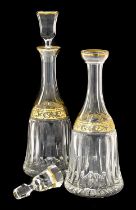 A Pair of Continental Glass Mallet Decanters and Stoppers, with cut facets and flutes and gilt