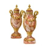 A Pair of French Gilt Metal Mounted Varigated Rouge Marble Urns and Covers, in Louis XVI style, of