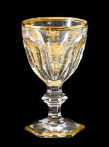 A Set of Six Baccarat Harcourt Empire Pattern Red Wine Glasses, the faceted bowls gilt with