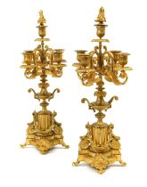 A Pair of Gilt Metal Five-Light Candelabra, in Louis XVI style, with floriform finials, fluted urn