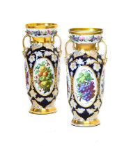A Pair of French Porcelain Baluster Vases, circa 1870, with flared necks and scroll handles, painted