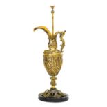 A Gilt Metal Ewer, in Renaissance style, with mermaid handle, cast with mythical figures, on a