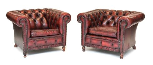 A Pair of Millbrook Reproduction Buttoned and Close-Nailed Ox Blood Leather Library Armchairs,