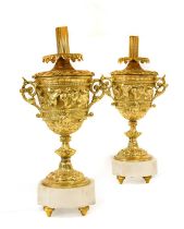 A Pair of Gilt Metal Table Lamps, in Louis XIV style, as twin-handled urns cast with fruit and