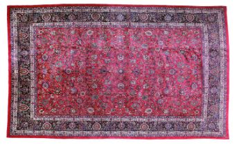 Mashad Carpet North East Iran, circa 1960 The crimson field with an allover design of vines and