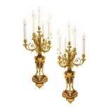 A Pair of Gilt Metal Mounted Rouge Marble Six-Light Candelabra, in Louis XVI style, with urn sconces