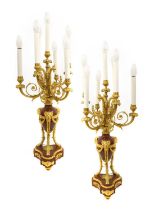 A Pair of Gilt Metal Mounted Rouge Marble Six-Light Candelabra, in Louis XVI style, with urn sconces