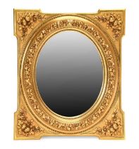 A Victorian Carved Giltwood and Gesso Oval Wall Mirror, the bevelled glass mirror plate within a