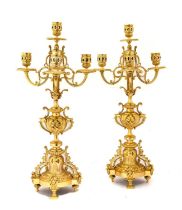 A Pair of Gilt Metal Five-Light Candelabra, in Louis XIV style, with pierced drum sconces,