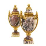 A Pair of Gilt Metal Mounted Pink and Grey Marble Urn Shape Vases and Fixed Covers, in Louis XVI