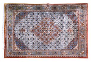 Indian Carpet, circa 1960 The ivory Herati field centred by an ice blue medallion framed by