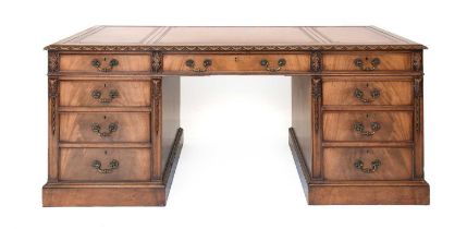 A Carved Mahogany Double Pedestal Desk, late 19th/early 20th century, in George III style, the light