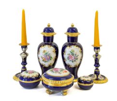 A Pair of Vienna Porcelain Candlesticks, 20th century, of baluster form, decorated with sprays of
