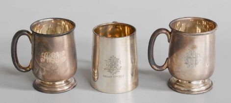 Three silver mugs, One London, 1926 and Two Birmingham, 1957 and 1958, each variously tapering