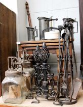 Two Glass Butter Churns, cast iron press, pair of wrought iron fire dogs, four pewter meaures,