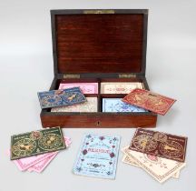 A French Mahogany Cased Bezique Set, circa 1900, with brass inlay and fitted interior, together with