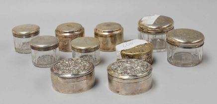 A Collection of Nine Assorted Swedish Silver or Silver-Mounted Glass Dressing-Table Jars, comprising