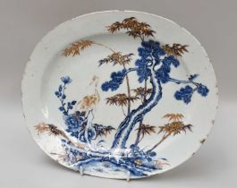 A Chinese Porcelain Platter, 18th Century, painted in underglaze blue, iron red and gilt with a