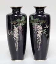 A Pair of Japanese Cloisonne Vases, Meiji period, ground in dark blue and decorated with wisteria,