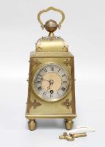 An Arts & Crafts Brass Mantel Timepiece, 20cm high over handle