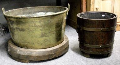 A Staved Oak Coal Bucket, with metal liner, together with a large brass cauldron on wooden stand,