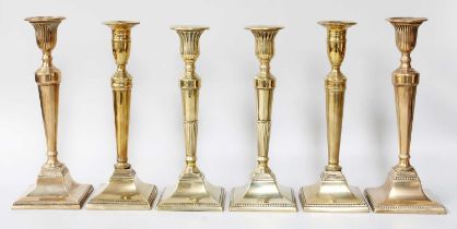 Three Pairs of George III Brass candlesticks