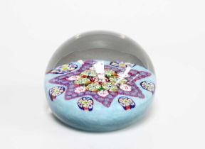 A Paul Ysart Paperweight, 20th century, with a star formation of canes on a pale blue ground with