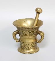 A Bronze Pestle and Mortar, in 17th century style, decorated in relief with scrolling bands, Latin