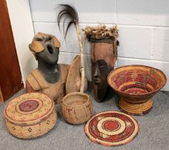 Ethnographica, including a West African mask with pigment and feather decoration, various baskets